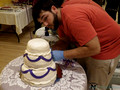 Frank puts the finishing touches on the cake
